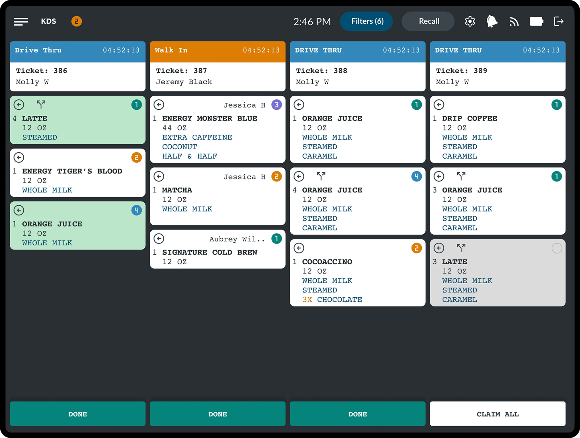Crisp kitchen display system showing active drive-thru, walk-in, and counter orders with color-coded ticket cards and item modifiers